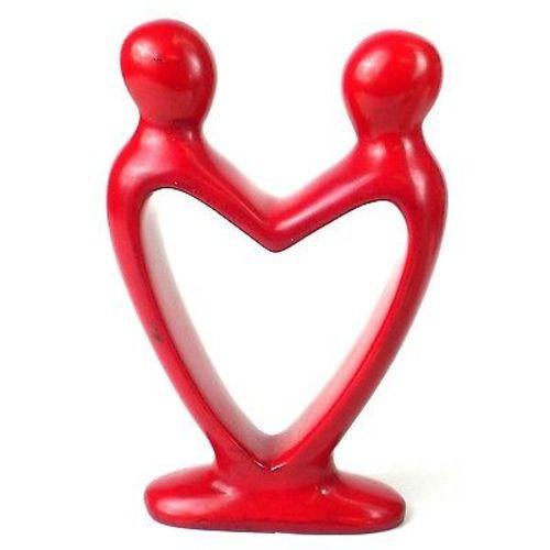 Handcarved from soapstone, this unique sculpture represents two lovers in the shape of a heart. Measures 8 inches tall.