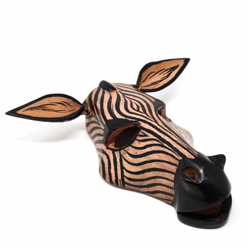 This wood zebra mask is hand-carved by members of the Kamba tribe in Kenya.Mask features detailed hand-painted stripes on the zebra's head and measures approximately 8.5 inches high x 4 inches deep.