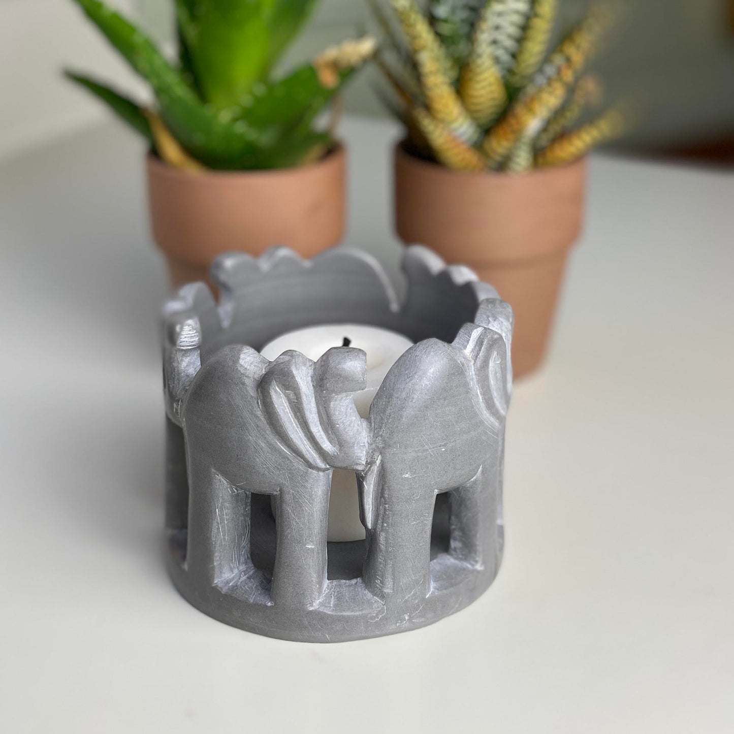 circle-of-elephants-soapstone-sculpture-3-to-3-5-inch-dark-stone