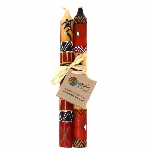 Hand painted in South Africa, this pair of candles is tied with raffia. Each candle is 9 inches tall by 0.75 inches in diameter.