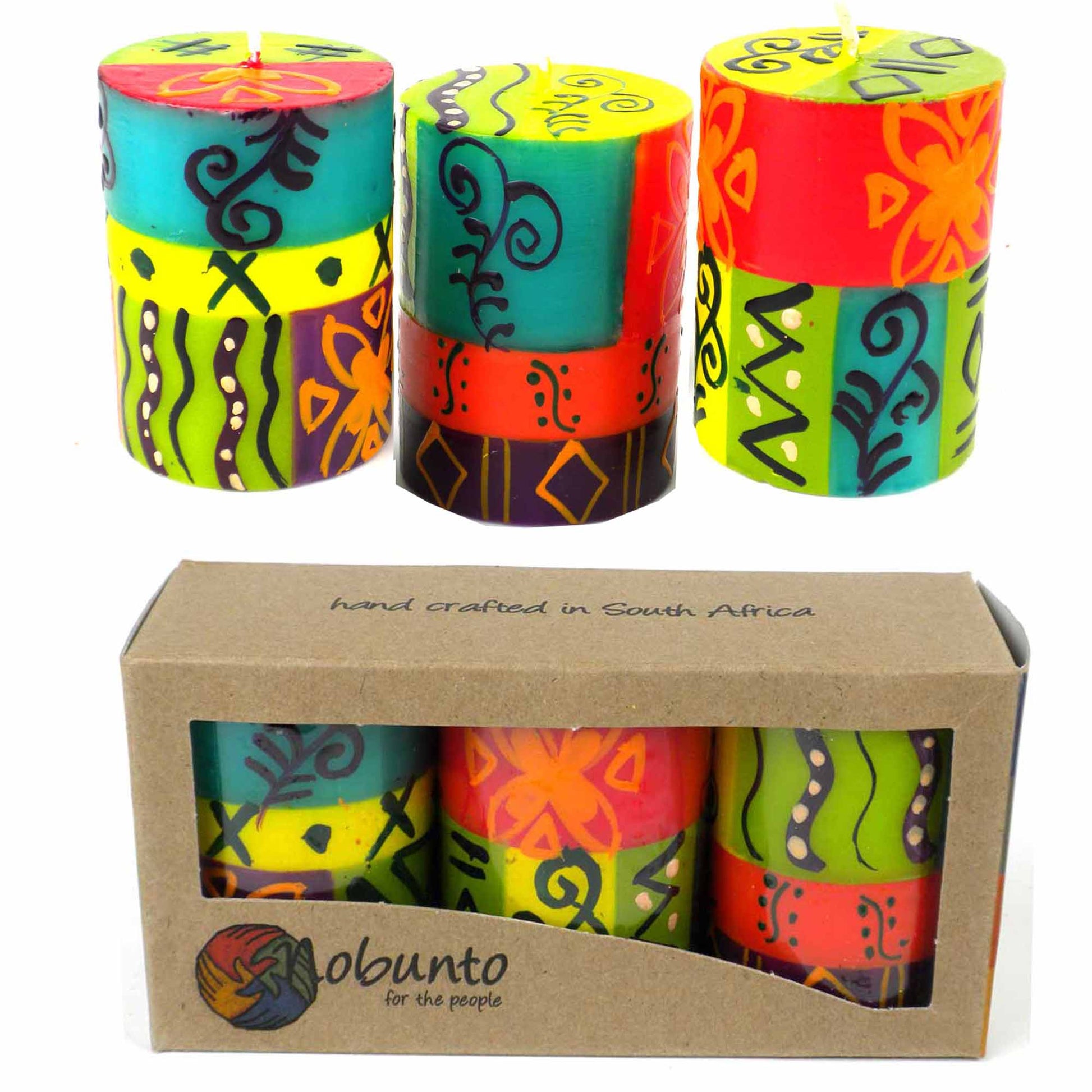 This set of three candles, hand-painted by South African artisans, arrives in a recycled cardboard gift box.  Each candle is 2.5 inches tall by 1.75 inches in diameter.
