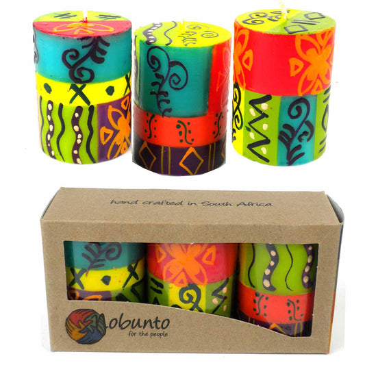 This set of three candles, hand-painted by South African artisans, arrives in a recycled cardboard gift box.  Each candle is 2.5 inches tall by 1.75 inches in diameter.