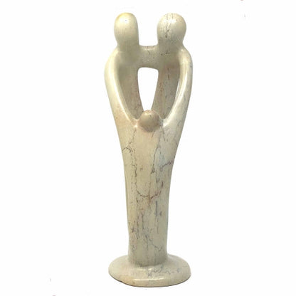African Soapstone is among the most beautiful in the world. Mined by hand from surface mines large stones are pulled by a team of workers, cleaved into smaller pieces and worked into stunning art and functional objects. This sculpture depicts a stylized family.  The soapstone is natural.  Please allow for color variation from cream to pink to gray in any single piece.  Dimensions: 8 inches tall by 4 inches wide and 3 inches in diameter.