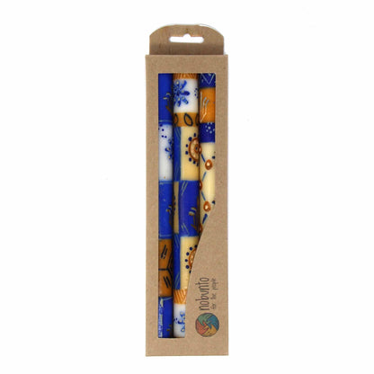 Hand painted by South African artisans, this set of three candles comes in gift box. Each candle is 9 inches tall by 0.75 inches in diameter.