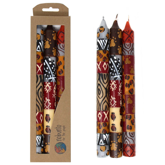 This set of three candles, hand-painted by South African artisans, arrives in a recycled cardboard box.  Each candle is 9 inches tall by 0.75 inches in diameter.