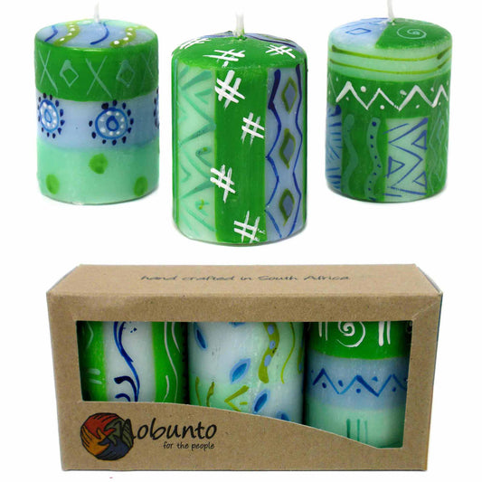 This set of three candles, hand-painted by South African artisans, arrives in a recycled cardboard gift box.  Each candle is 2.5 inches tall by 1.75 inches in diameter.