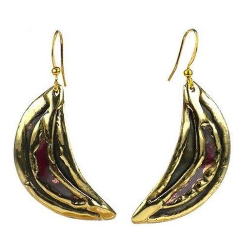 Handcrafted by South African artisans, these earrings are slices of brass with a red copper center. The coloration of the 1.6-inch long earrings which hang from brass hooks, is achieved by applying high heat rather than paints or dyes.