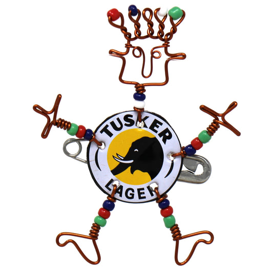 This dancing girl pin is made from a local beer bottle cap and copper wire and accented with colorful Maasai beads. Mounted on a safety pin for attaching to a lapel, hat, or backpack, the pin is approximately 2 inches tall. Bead colors may vary from shown.