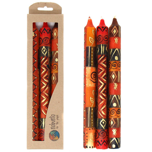 This set of three candles, hand-painted by South African artisans, arrives in a recycled cardboard box.  Each candle is 9 inches tall by 0.75 inches in diameter.