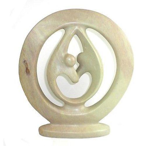 Hand carved from soapstone, these sculptures feature a representation of two lovers in circle. The piece is carved from one piece of soapstone and is about 6 inches tall.