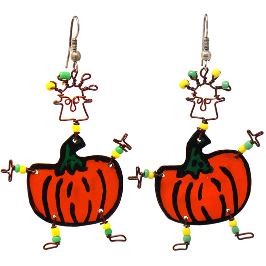 This handmade novelty pair of dancing girl earrings features a playful pumpkin design made from recycled tin can and copper wire, accented with colorful Maasai beads. Earrings hang approximately 2 inches.