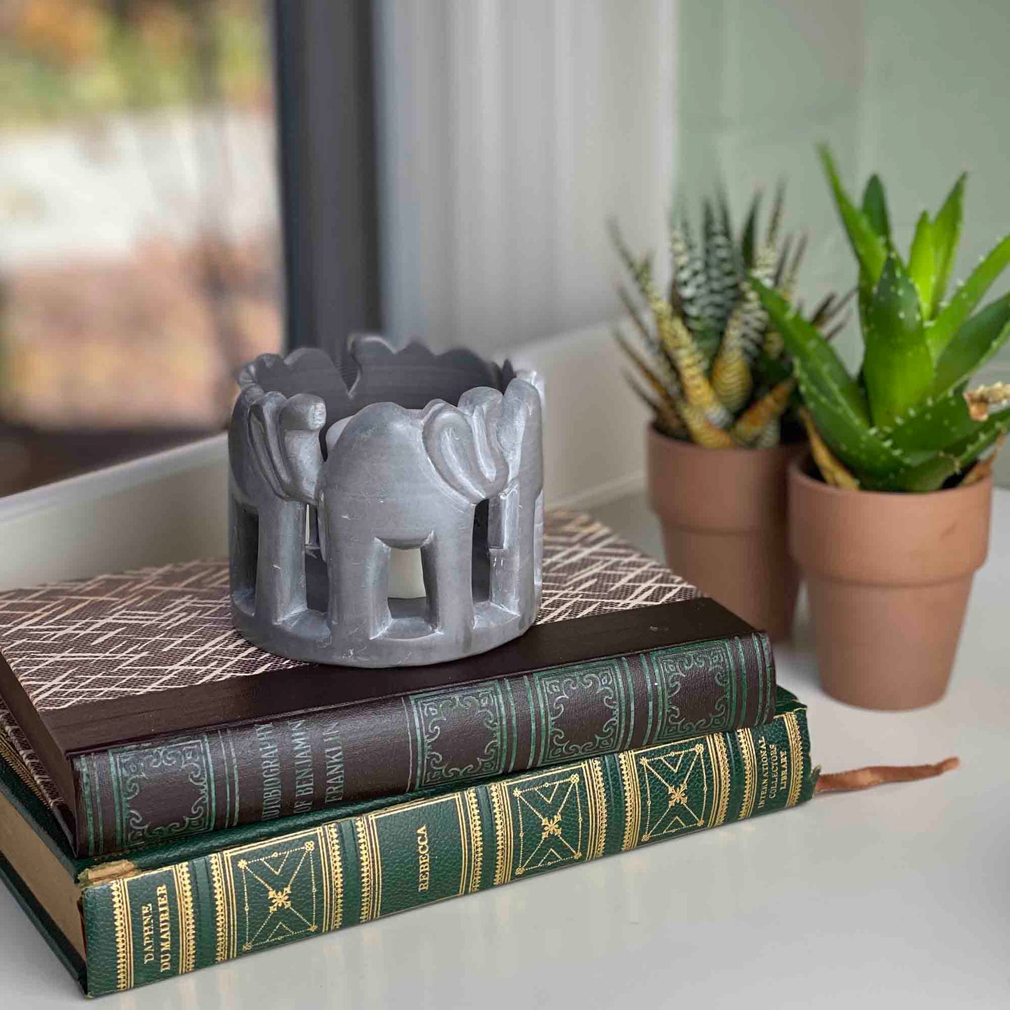 circle-of-elephants-soapstone-sculpture-3-to-3-5-inch-dark-stone