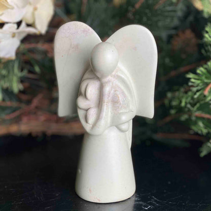 angel-soapstone-sculpture-holding-dog