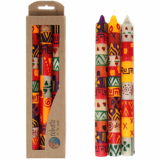 This set of three candles, hand-painted by South African artisans, arrives in a recycled cardboard box.  Each candle is 9 inches tall by 0.75 inches in diameter.