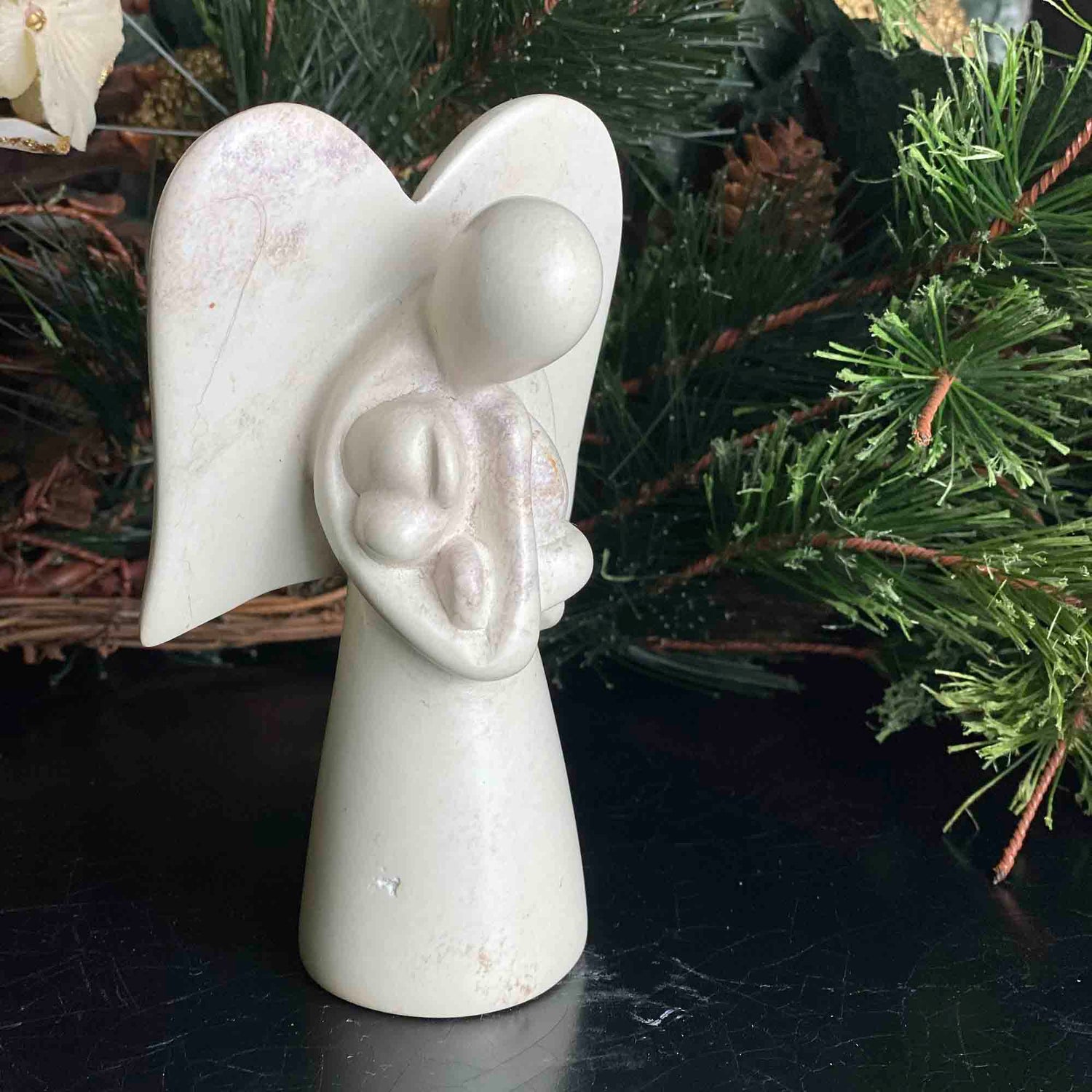 angel-soapstone-sculpture-holding-dog
